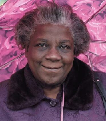 Photo of Joyce Baptiste with umbrella, Steering group member